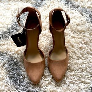 Brand new Tan wedge heels.